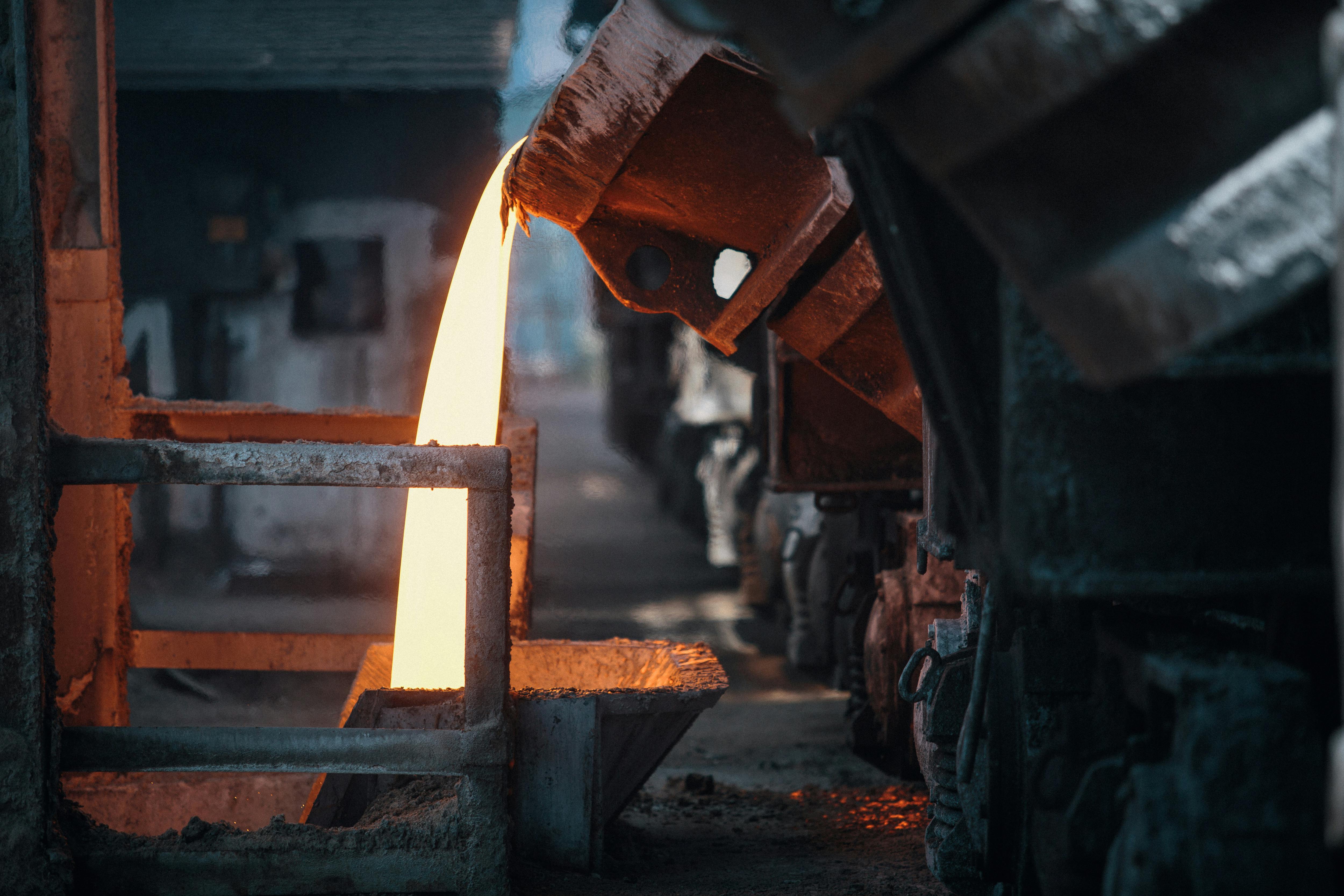 Molten metal poured from an induction furnace